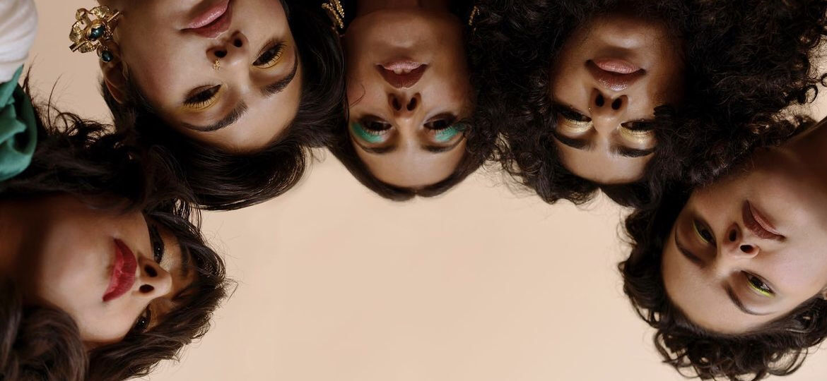 faces of 5 young women seen from below